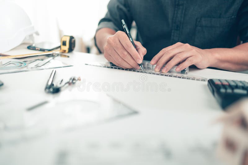 Architect Engineer Use Pen and Mini Tslide Drawing Design Working on