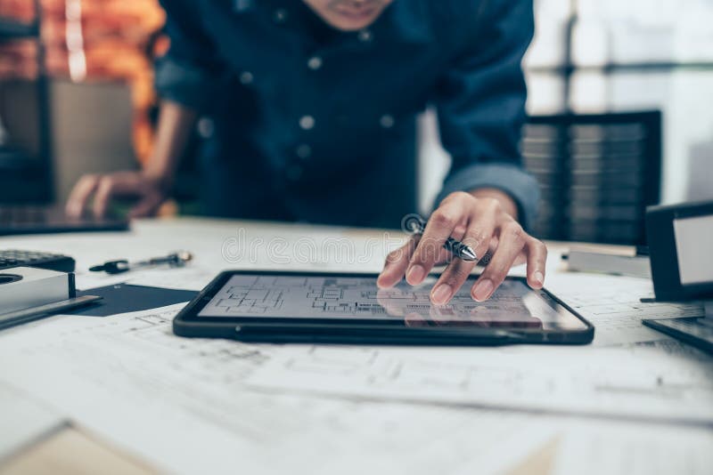 Architect Engineer Use Tablet To Read Drawing Design. House Planning