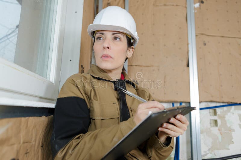Architect holding blueprints and clipboard royalty free stock image Architect holding blueprints and clipboard royalty free stock image
