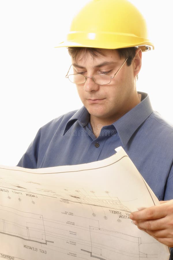 A man reading architectural plans. Architect uniform stock images, royalty-free photos and pictures