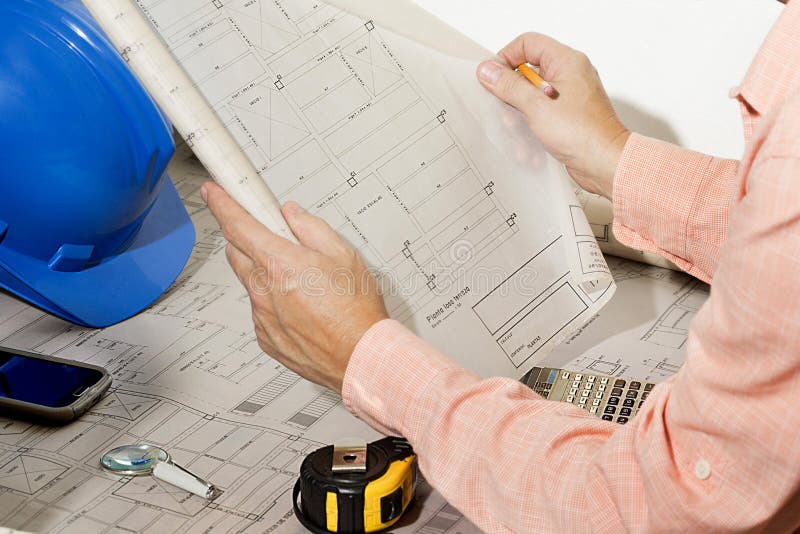 Architect reviewing and showing architecture sketch. stock photography