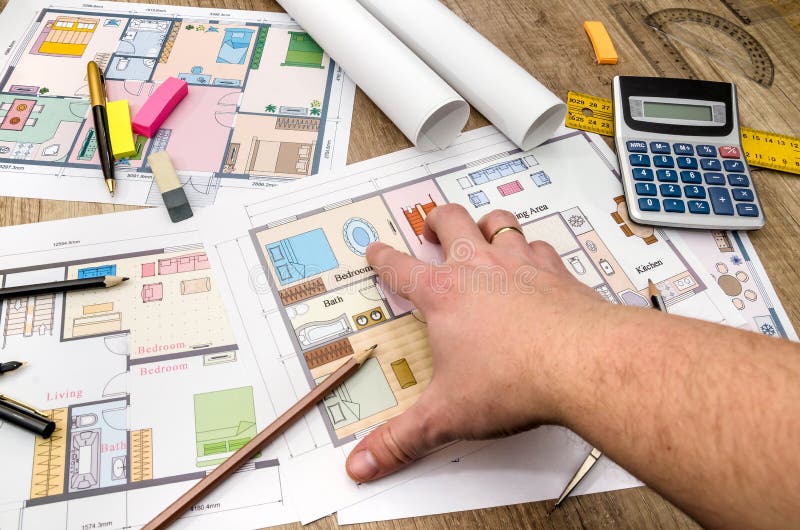 Architect reviewing and showing blueprint. stock photo