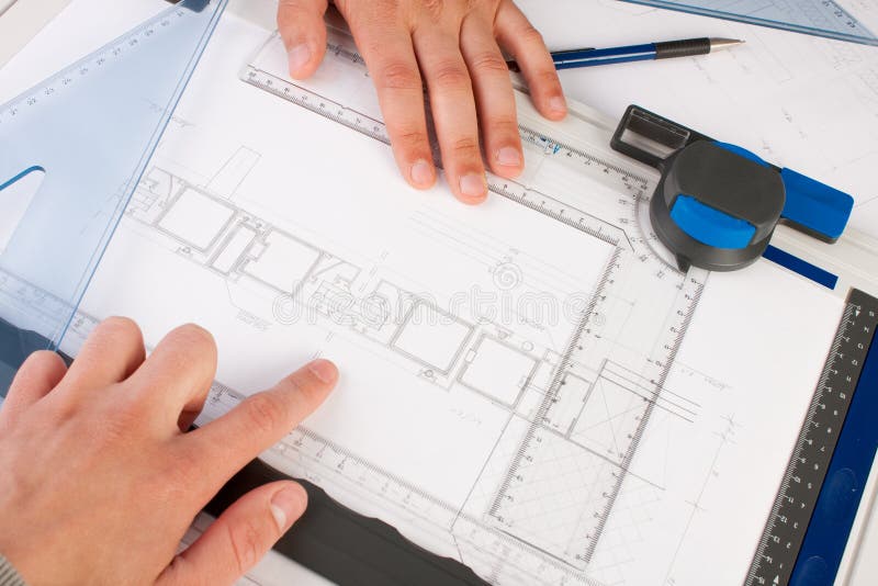 Architect working on architectural plans