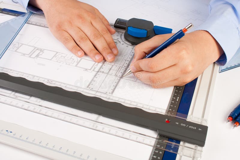 Architect working on architectural plans