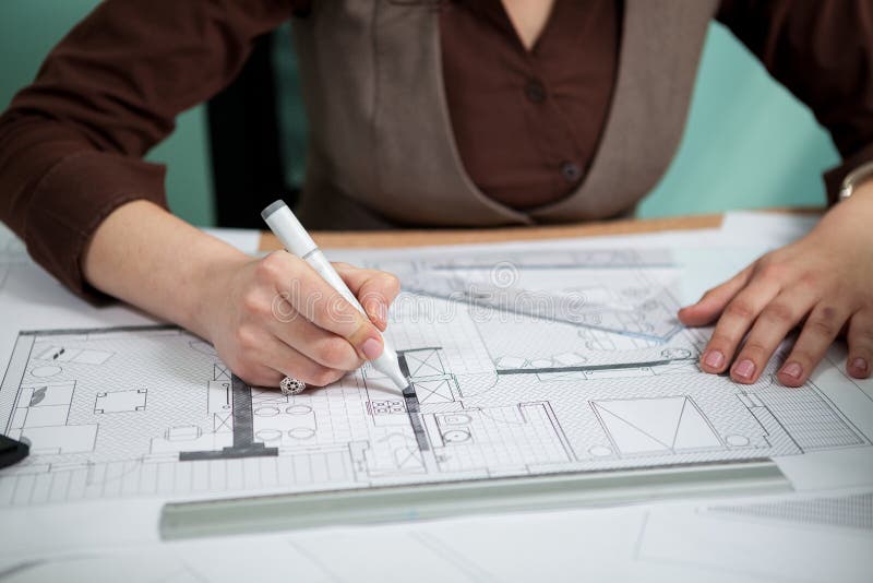 Architect Working on Blueprints on Her Desk Stock Image Image of