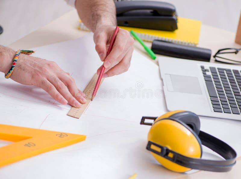 The architect working in his studio on new project