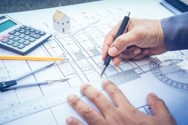 Architect working with plan design.Concepts of architecture,construction,engineering. Architect working with plan design.Concepts of architecture,construction,engineering.