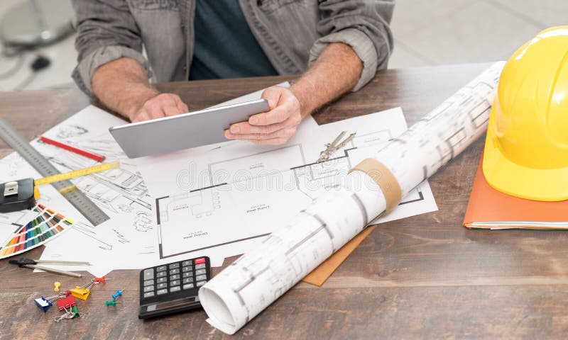 Architect working on plans stock photos