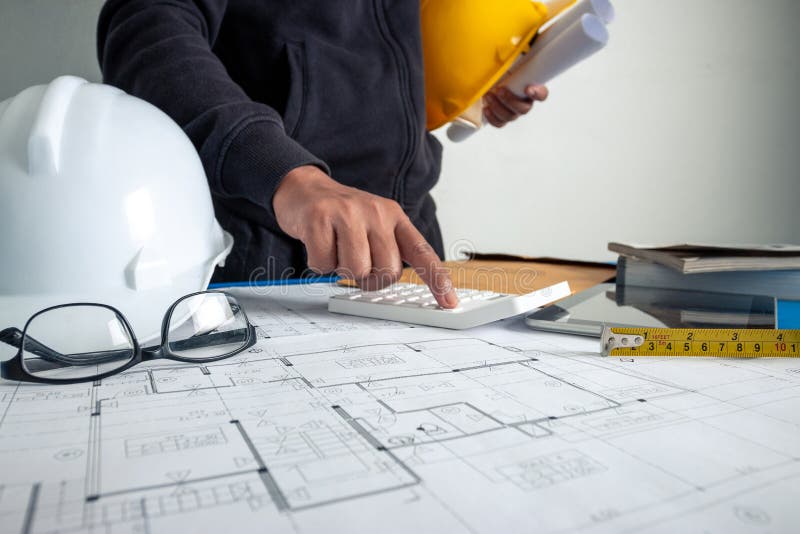 The Architect is Working To Design the Building at the Office Desk