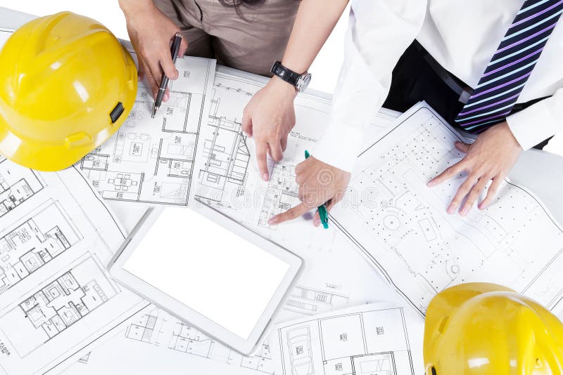 Architects discussing blueprint stock images