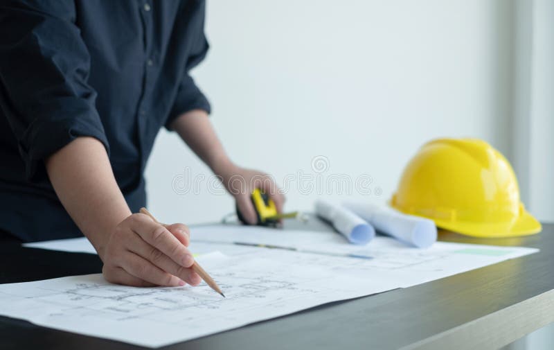 Architects or Engineers Working Construction and Drawing Construction