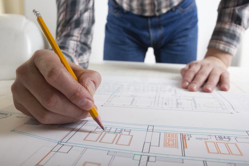 Architects Working on Blueprint, Real Estate Project. Architect