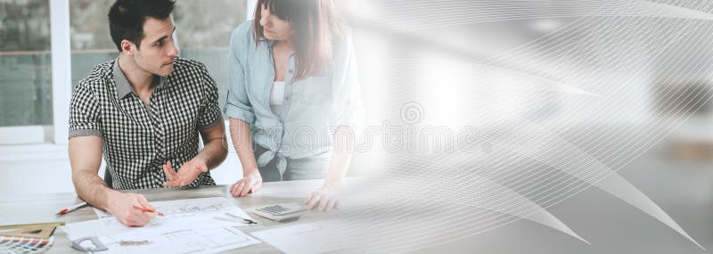 Architects working on plans; panoramic banner royalty free stock image Architects working on plans; panoramic banner royalty free stock image