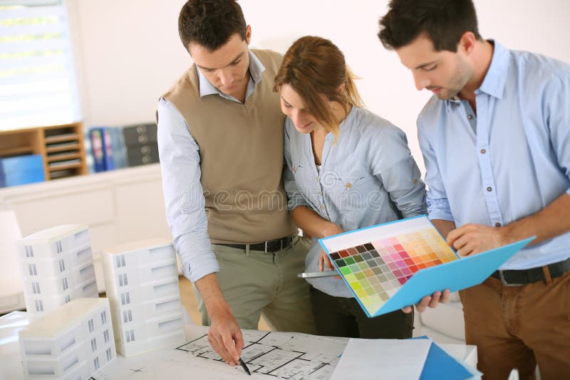 Architects working together on blueprint stock photos Architects working together on blueprint stock photos
