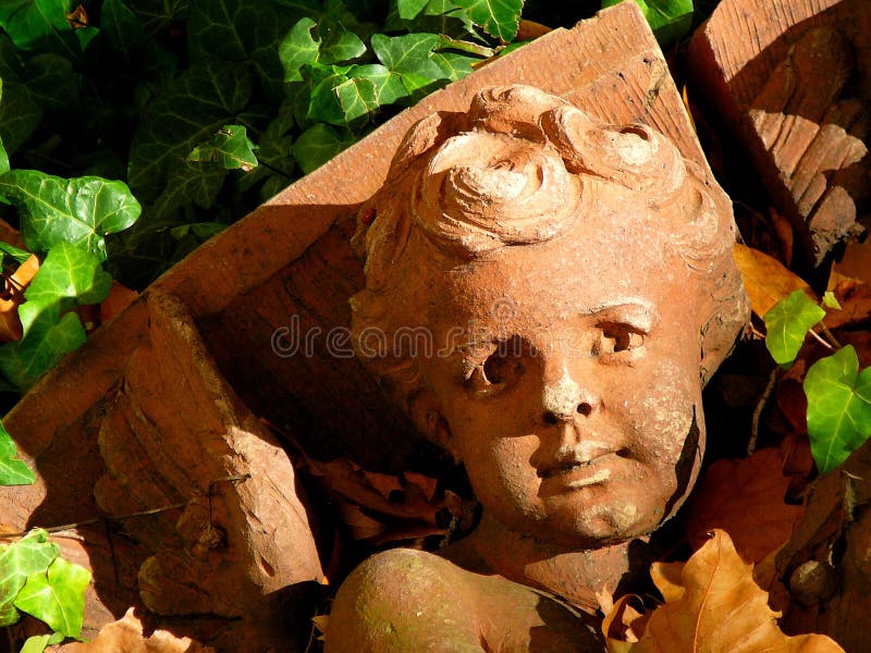 Architectural Detail of Fallen Cherub stock photos