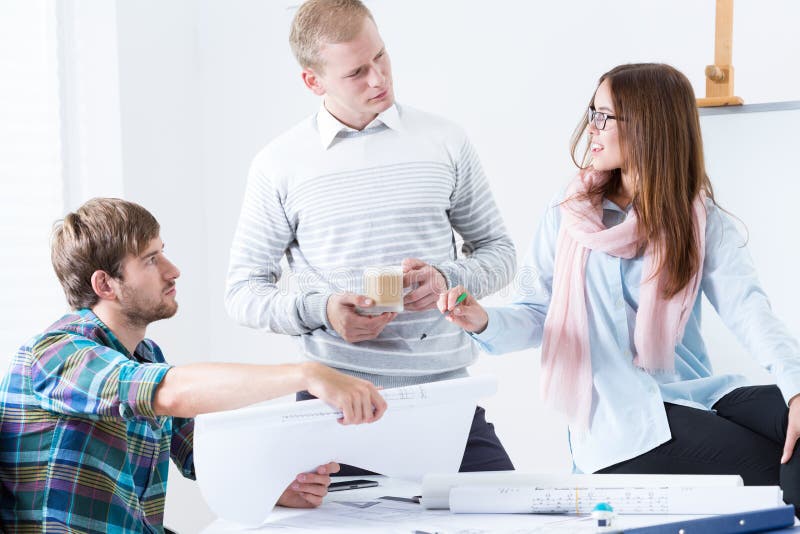 Architectural team working on project stock image