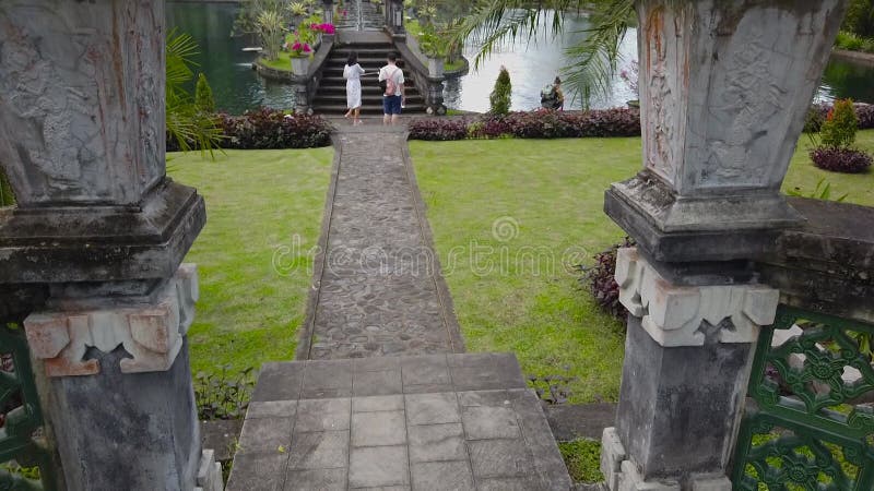 Architecture in Bali, Bridge over the lake in Bali. The traditional architecture of Bali. Antiquity architecture in bali stock footage