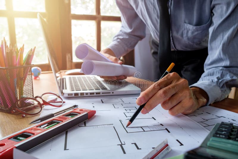 Architect hands with pen drawing blueprint. Architecture concept. royalty free stock photography
