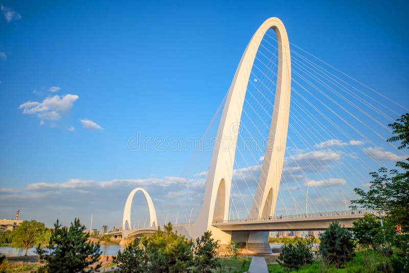 Architecture of cable stayed bridge with cloudy blue sky royalty free stock images