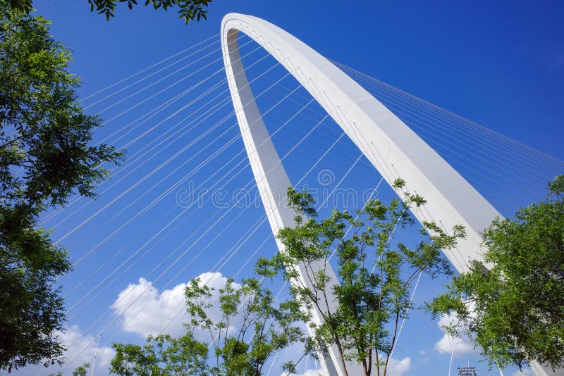 Architecture of cable stayed bridge with cloudy blue sky royalty free stock image