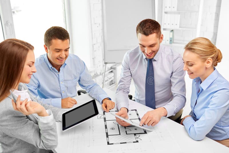 Happy business team discussing blueprint at office royalty free stock photos Happy business team discussing blueprint at office royalty free stock photos