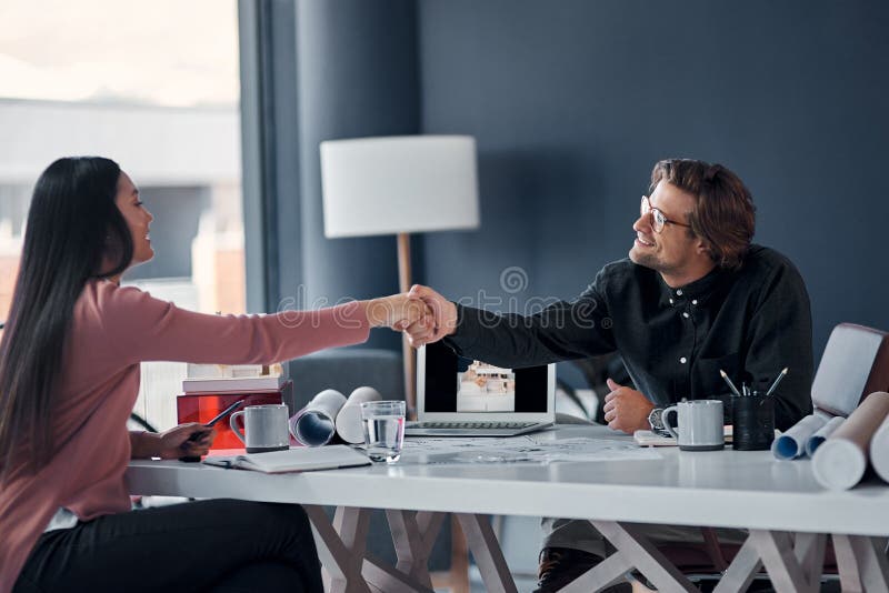 Architecture, meeting and business people with laptop, handshake or agreement in building development. Partnership, man stock photos