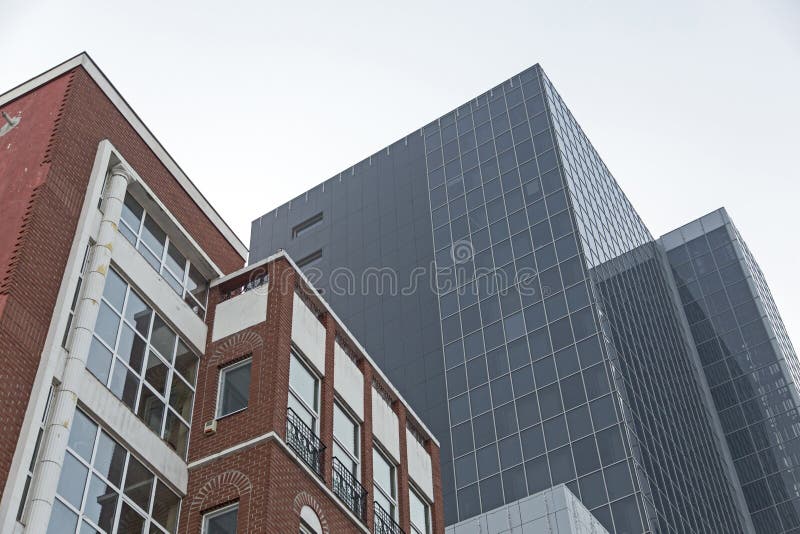 Architectural view of a old style building and a office one on background royalty free stock images