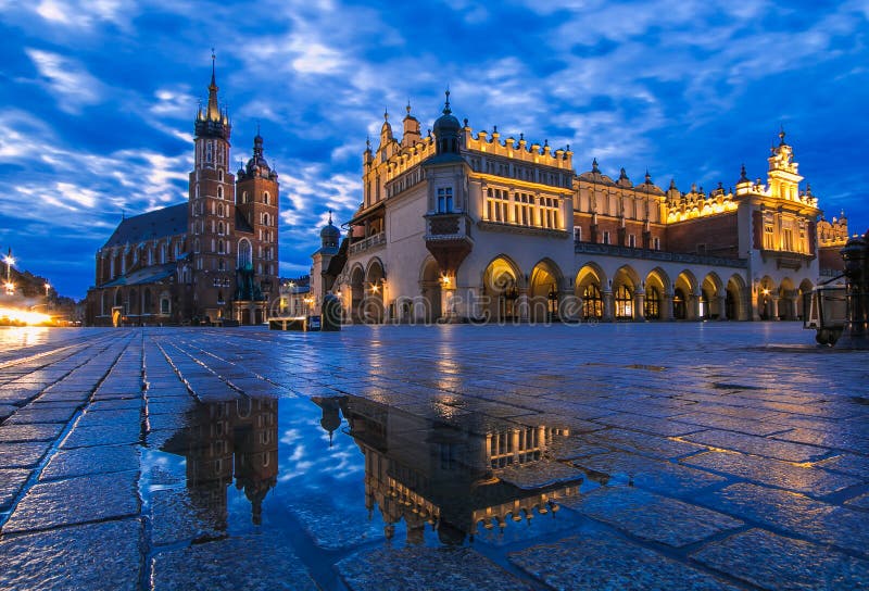 The architecture at the Rynek Glowny square with the church of St Mary in the old town of Kracow in Poland in east Europe at blue