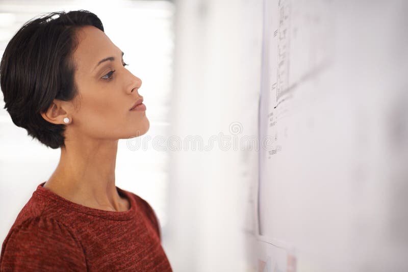 Architecture, thinking and woman with blueprint in office, brainstorming and checking ideas for building project. Civil stock photography