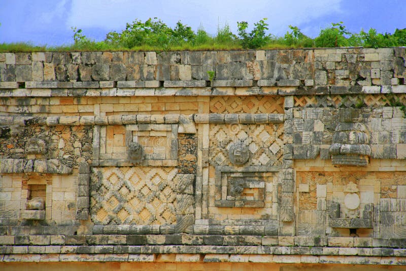 A wall with engravings made in mayan puuc architecture style in Uxmal, Yucatan peninsula, Mexico. A wall with engravings made in mayan puuc architecture style in Uxmal, Yucatan peninsula, Mexico