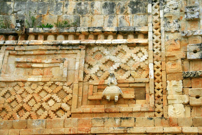 A wall with engravings made in mayan puuc architecture style in Uxmal, Yucatan peninsula, Mexico. A wall with engravings made in mayan puuc architecture style in Uxmal, Yucatan peninsula, Mexico