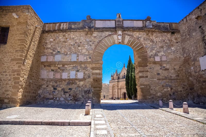 Statue of Pedro Espinosa in the Plaza de Santa Maria with a pavement cafe  and the giants arch to the rear, Antequera, Spain Stock Photo - Alamy