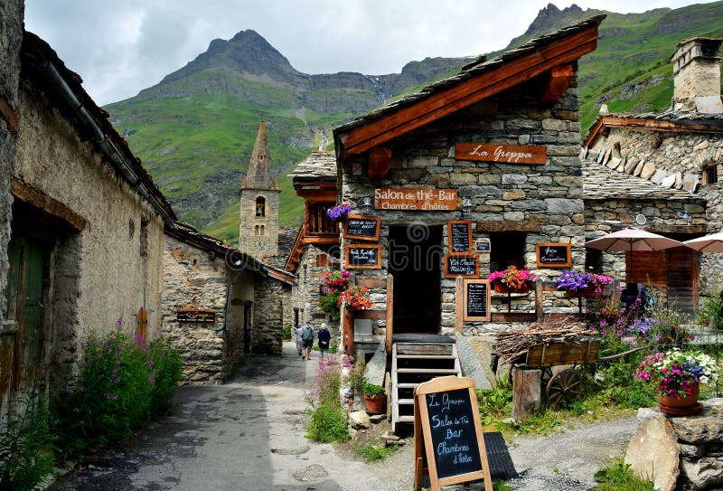 BONNEVAL SUR ARC -FRANCE - JULY 21, 2017. Traditional architecture with stone house in Bonneval-sur-Arc village, Savoie department of the Rhone Alpes, one of the most beautiful villages of France. BONNEVAL SUR ARC -FRANCE - JULY 21, 2017. Traditional architecture with stone house in Bonneval-sur-Arc village, Savoie department of the Rhone Alpes, one of the most beautiful villages of France.