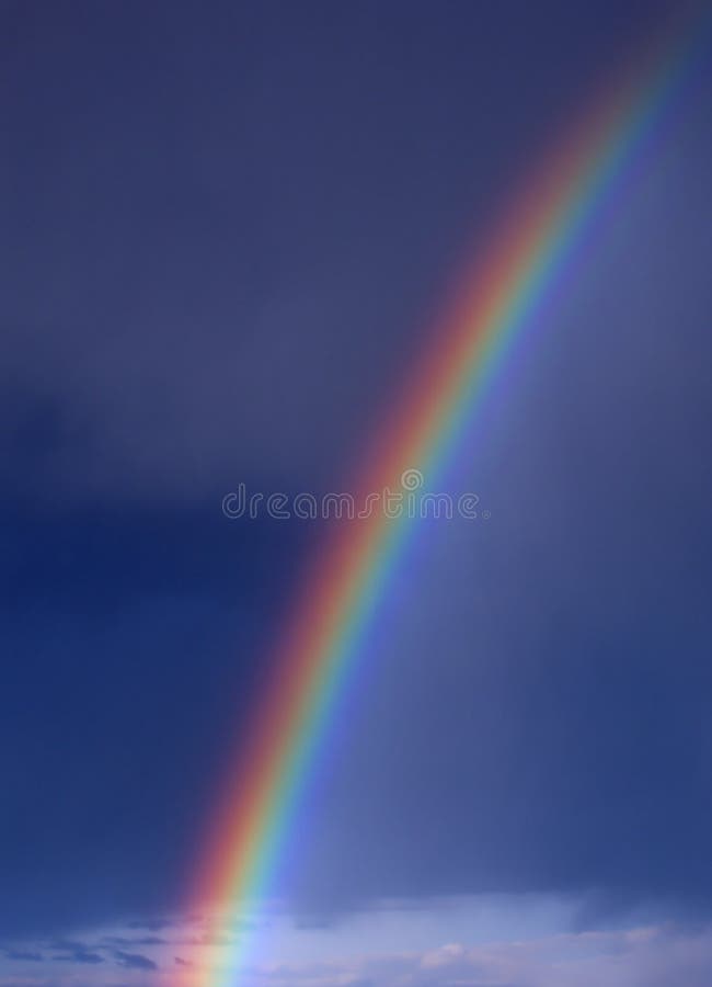 Rainbow in blue sky with clouds. Rainbow in blue sky with clouds