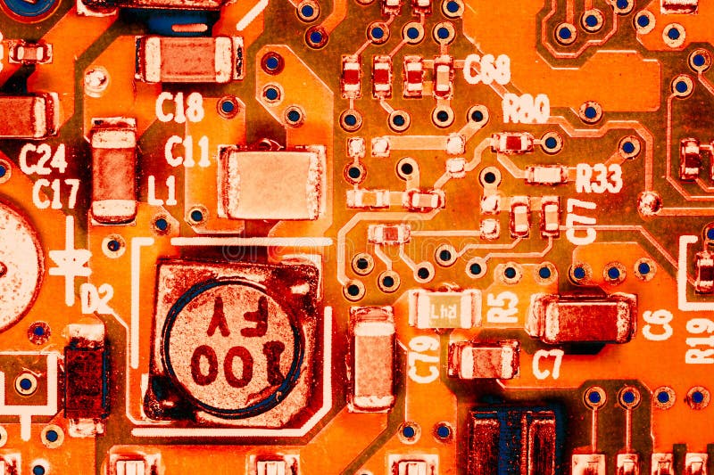 Ardware engineering backdrop: close up photo of integrated circuit colored in orange stock image