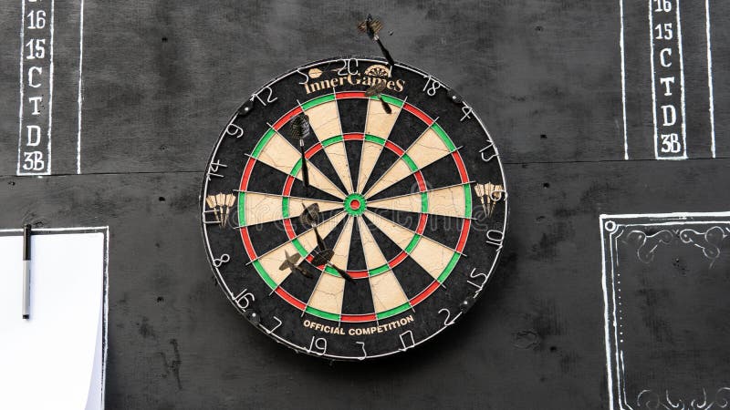 .area for playing darts with a sheet of glasses on a black background
