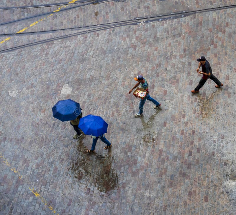 Areal concept shot of the people walking under the rain. People royalty free stock image
