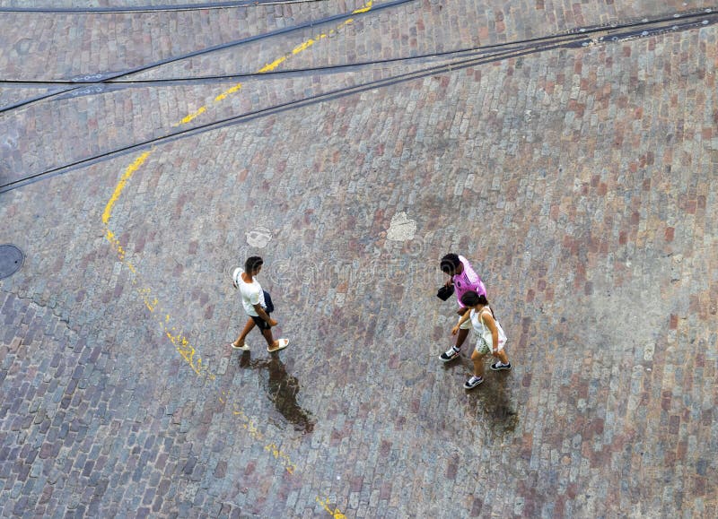 Areal concept shot of the people walking under the rain. Abstract stock photography