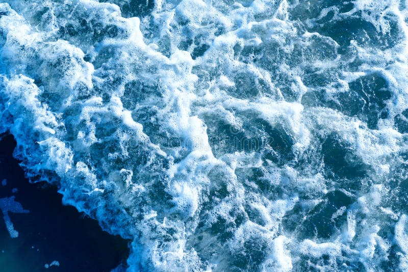 Deep blue sea water spray