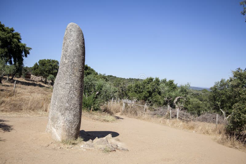 Menhir de almendres huge megalithic stone. The areas of Extremadura Spain and Alentejo Portugal bring together a huge amount of megalithic archaeological sites royalty free stock photography Menhir de almendres huge megalithic stone. The areas of Extremadura Spain and Alentejo Portugal bring together a huge amount of megalithic archaeological sites royalty free stock photography