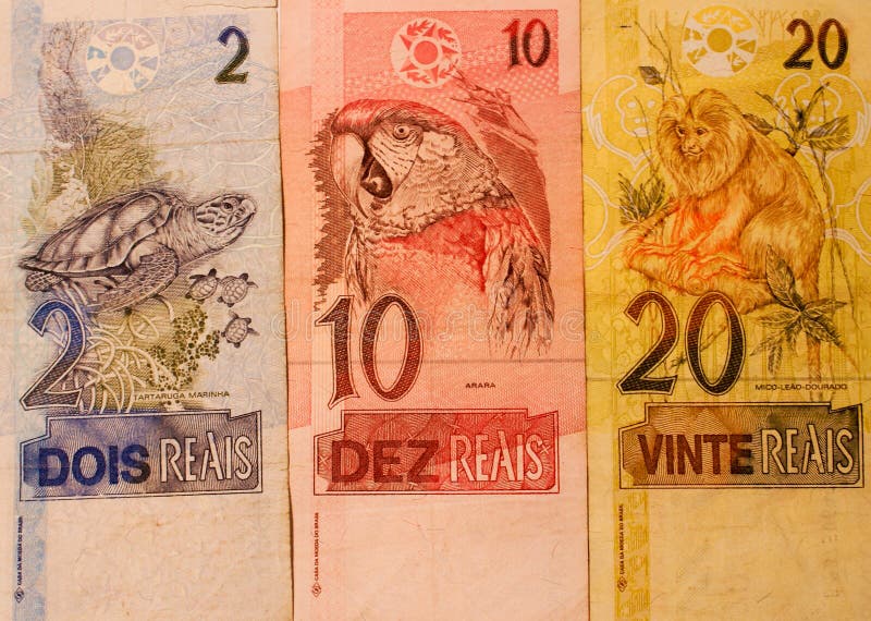 Brazilian money with two, ten and twelve reais banknotes. Brazilian money with two, ten and twelve reais banknotes.