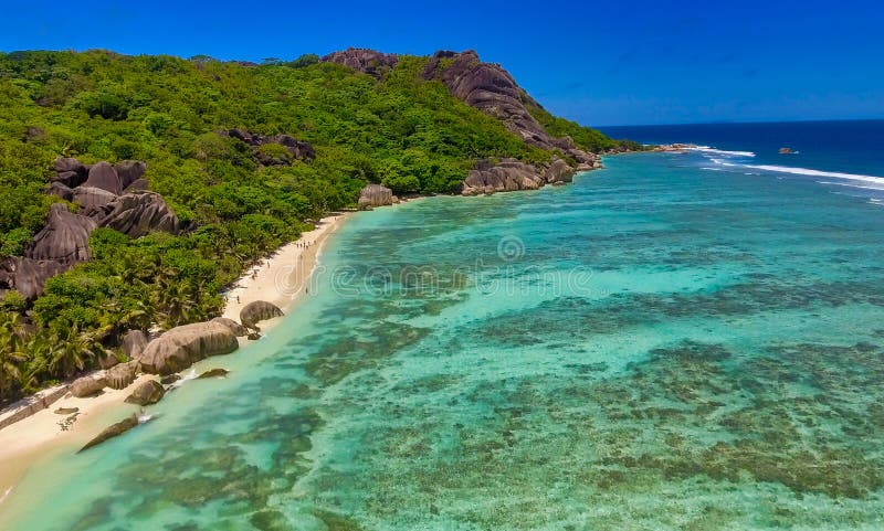 Anse Source Argent, La Digue. Amazing aerial view from drone on a beautiful sunny day - Seychelles Islands. Anse Source Argent, La Digue. Amazing aerial view from drone on a beautiful sunny day - Seychelles Islands