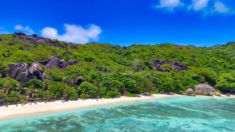 Anse Source Argent, La Digue. Amazing aerial view from drone on a beautiful sunny day - Seychelles Islands. Anse Source Argent, La Digue. Amazing aerial view from drone on a beautiful sunny day - Seychelles Islands