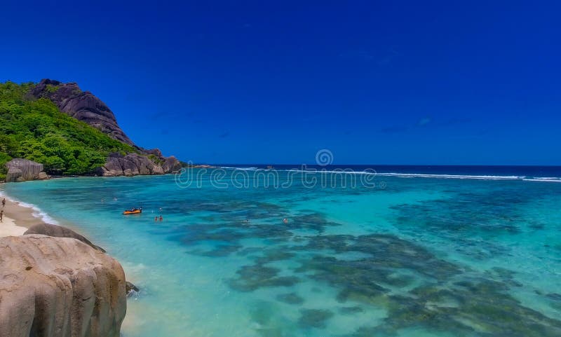 Anse Source Argent, La Digue. Amazing aerial view from drone on a beautiful sunny day - Seychelles Islands. Anse Source Argent, La Digue. Amazing aerial view from drone on a beautiful sunny day - Seychelles Islands