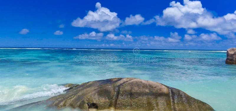 Anse Source Argent, La Digue. Amazing aerial view from drone on a beautiful sunny day - Seychelles Islands. Anse Source Argent, La Digue. Amazing aerial view from drone on a beautiful sunny day - Seychelles Islands