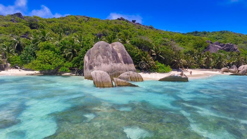 Anse Source Argent, La Digue. Amazing aerial view from drone on a beautiful sunny day - Seychelles Islands. Anse Source Argent, La Digue. Amazing aerial view from drone on a beautiful sunny day - Seychelles Islands