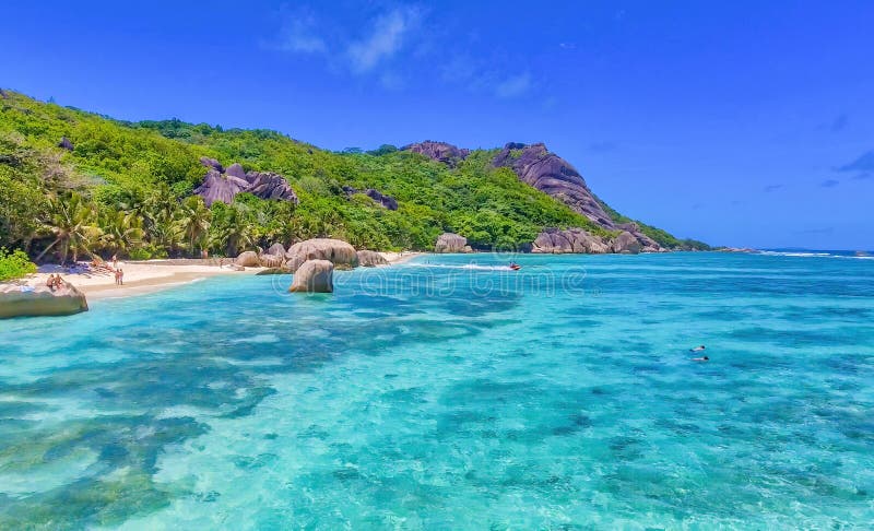 Anse Source Argent, La Digue. Amazing aerial view from drone on a beautiful sunny day - Seychelles Islands. Anse Source Argent, La Digue. Amazing aerial view from drone on a beautiful sunny day - Seychelles Islands