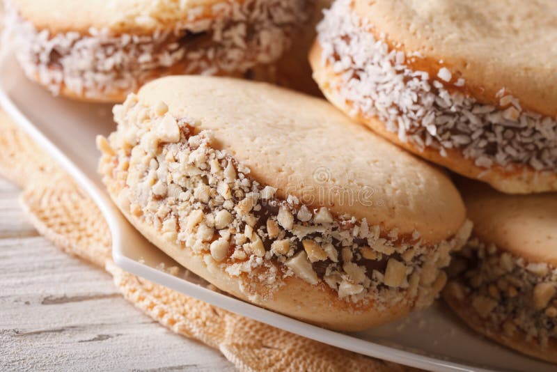 Argentinean dessert: cookies alfajores on a plate macro. horizon