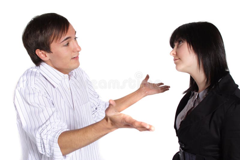 An attractive young couple having a dispute.All isolated on white background. An attractive young couple having a dispute.All isolated on white background.