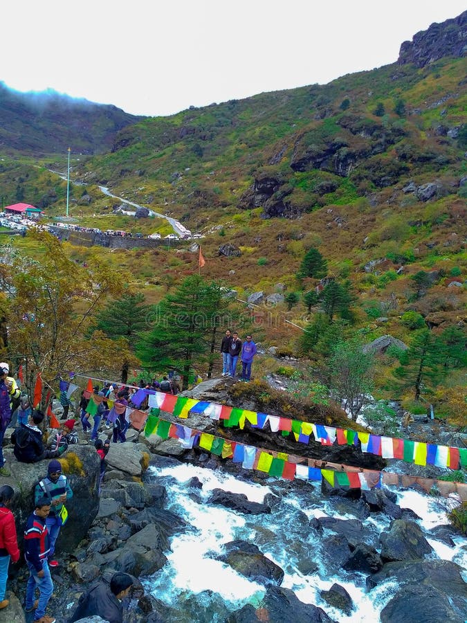 Arial shot of people enjoying the beautiful view surrounded by mountains and water falls at Sikkim,India on 14 October 2017 stock photo Arial shot of people enjoying the beautiful view surrounded by mountains and water falls at Sikkim,India on 14 October 2017 stock photo